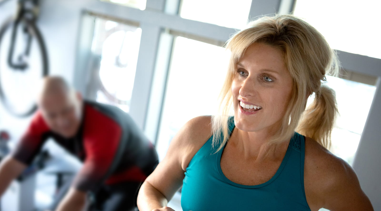 Image of patient Stacy Ahearn exercising in a gymnasium