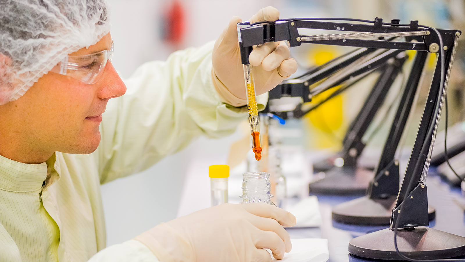Picture of a scientist at a work station