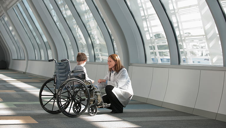 Doctor speaking to young boy