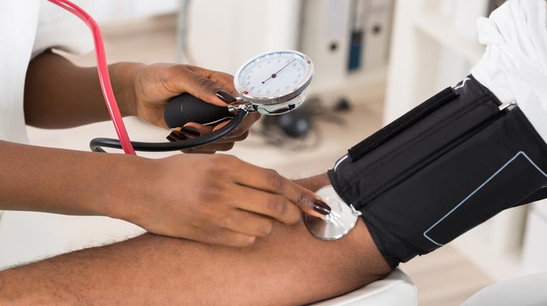 Hemophilia Doctor Measuring Patients Blood Pressure