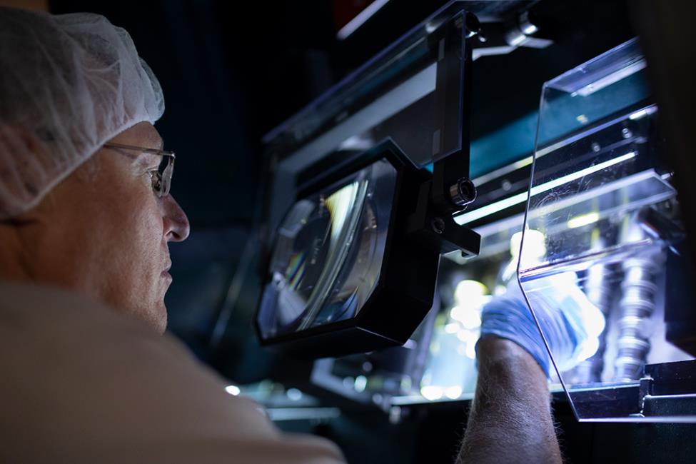 Worker inspects medicine at CSL Behring Kankakee, Illinois, manufacturing site