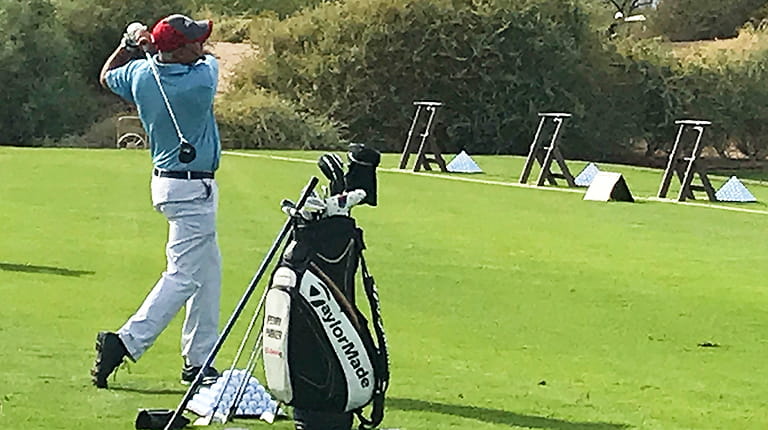Pro golfer and hemophilia patient Perry Parker on the driving range at CSL Behring's Junior National Championship.