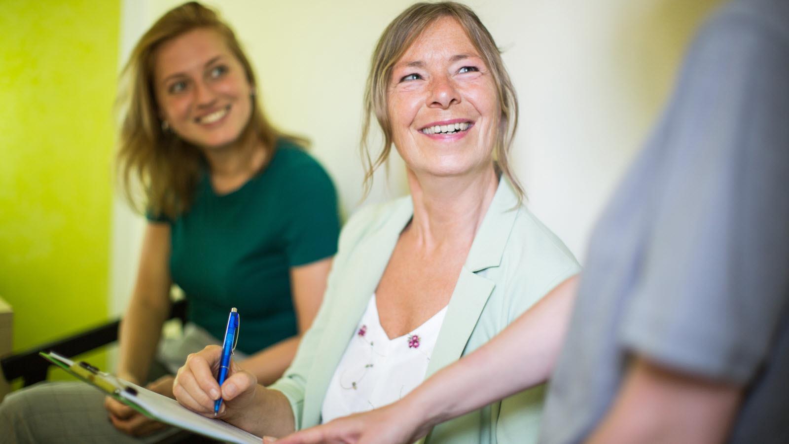 photo illustration of a women signing a document as part of a clinical trial