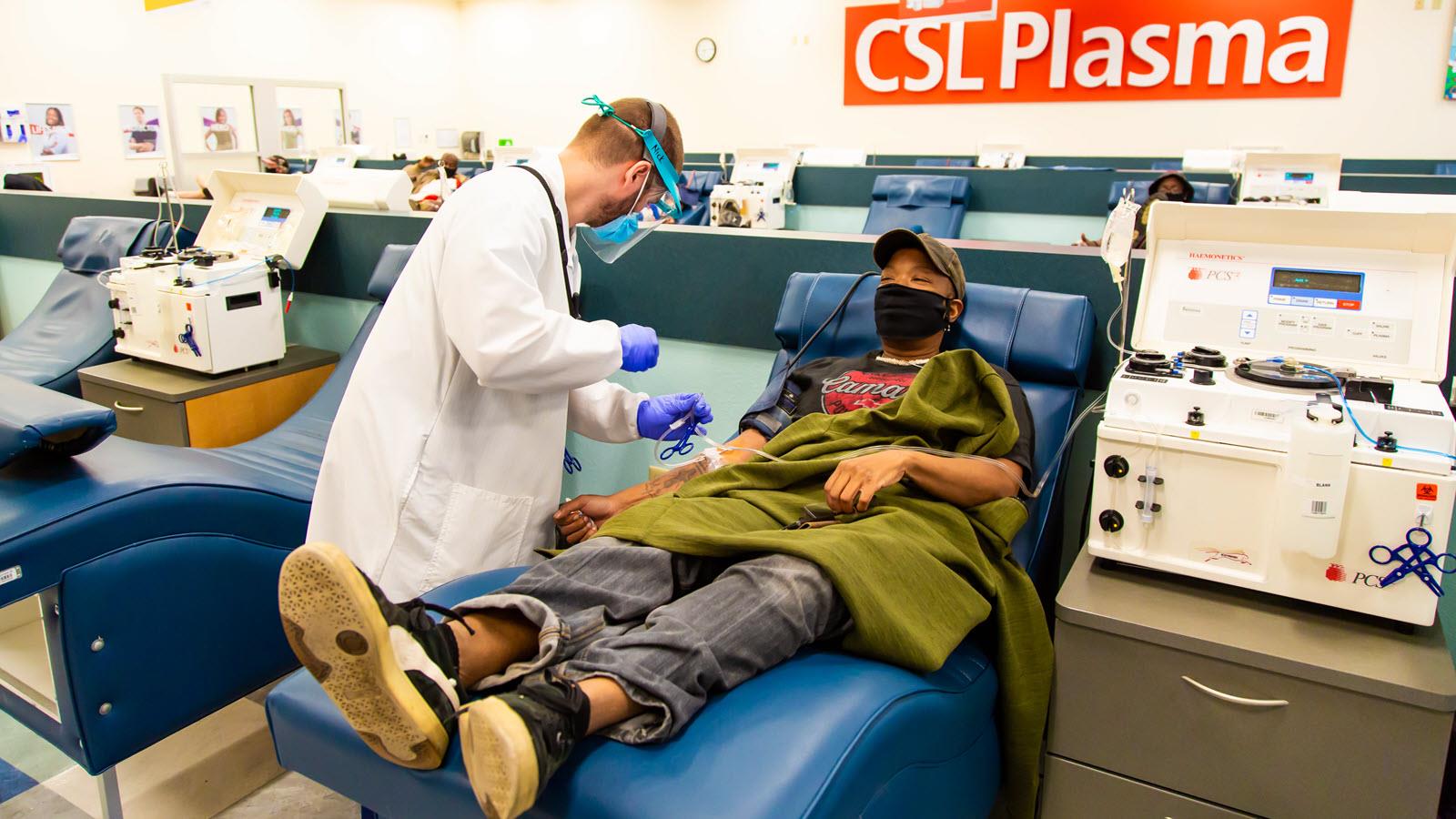 Masked donor donating plasma