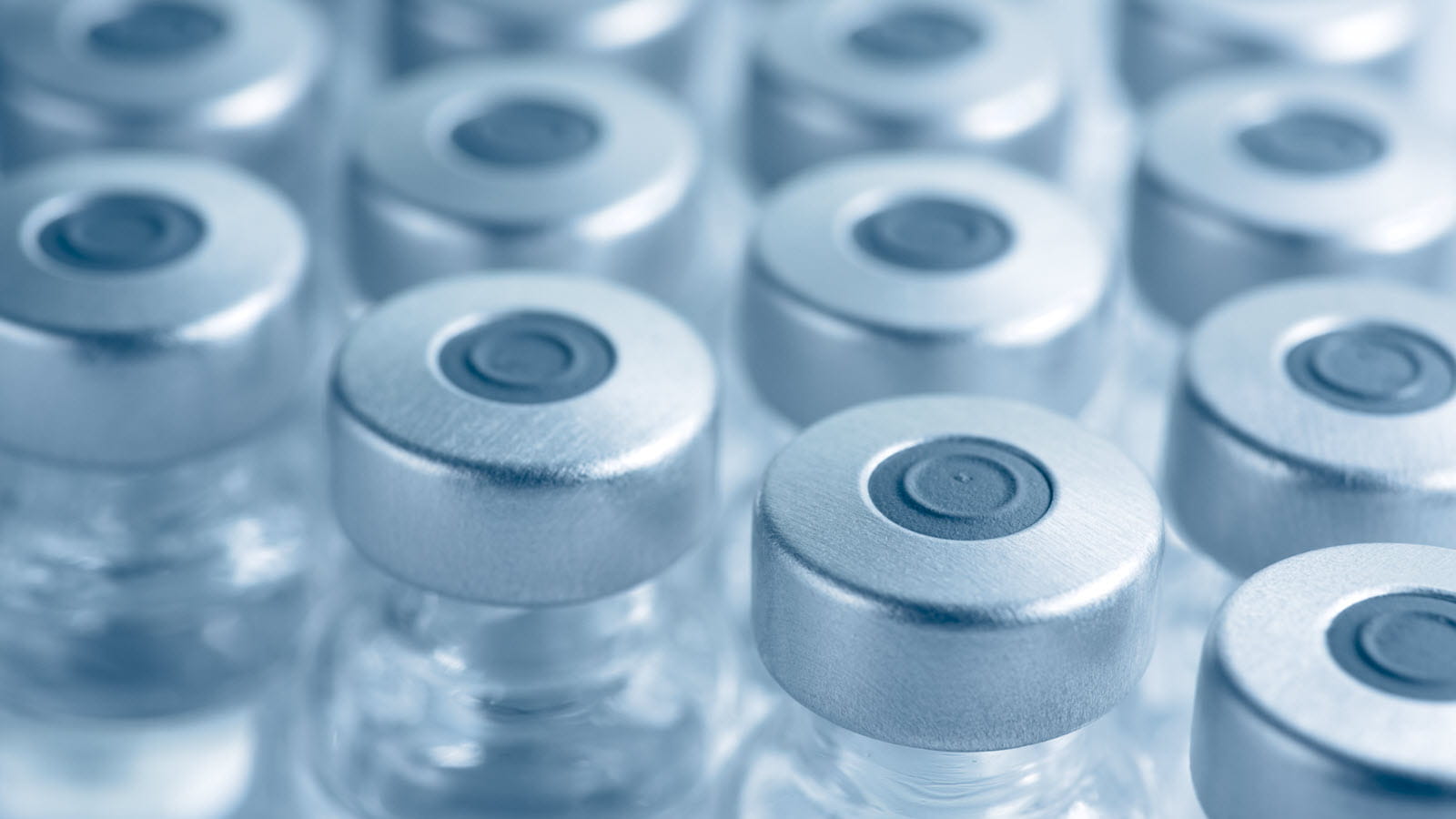 vials of medicine with silver caps