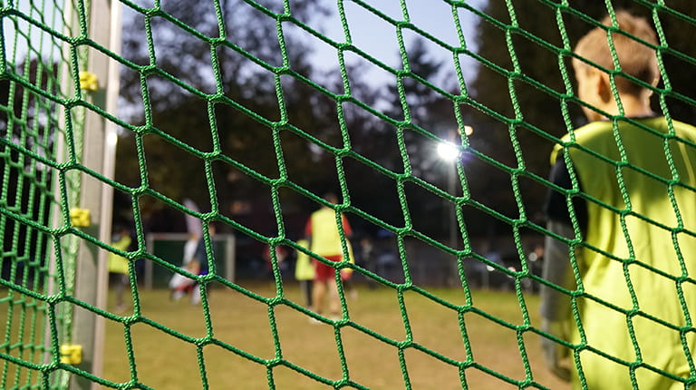 Children play soccer at Sempech Park in Bern, Switzerland. Below ground, an environmentally friendly wastewater system reduces the burden on the local water treatment facility and contributes to the production of clean energy.