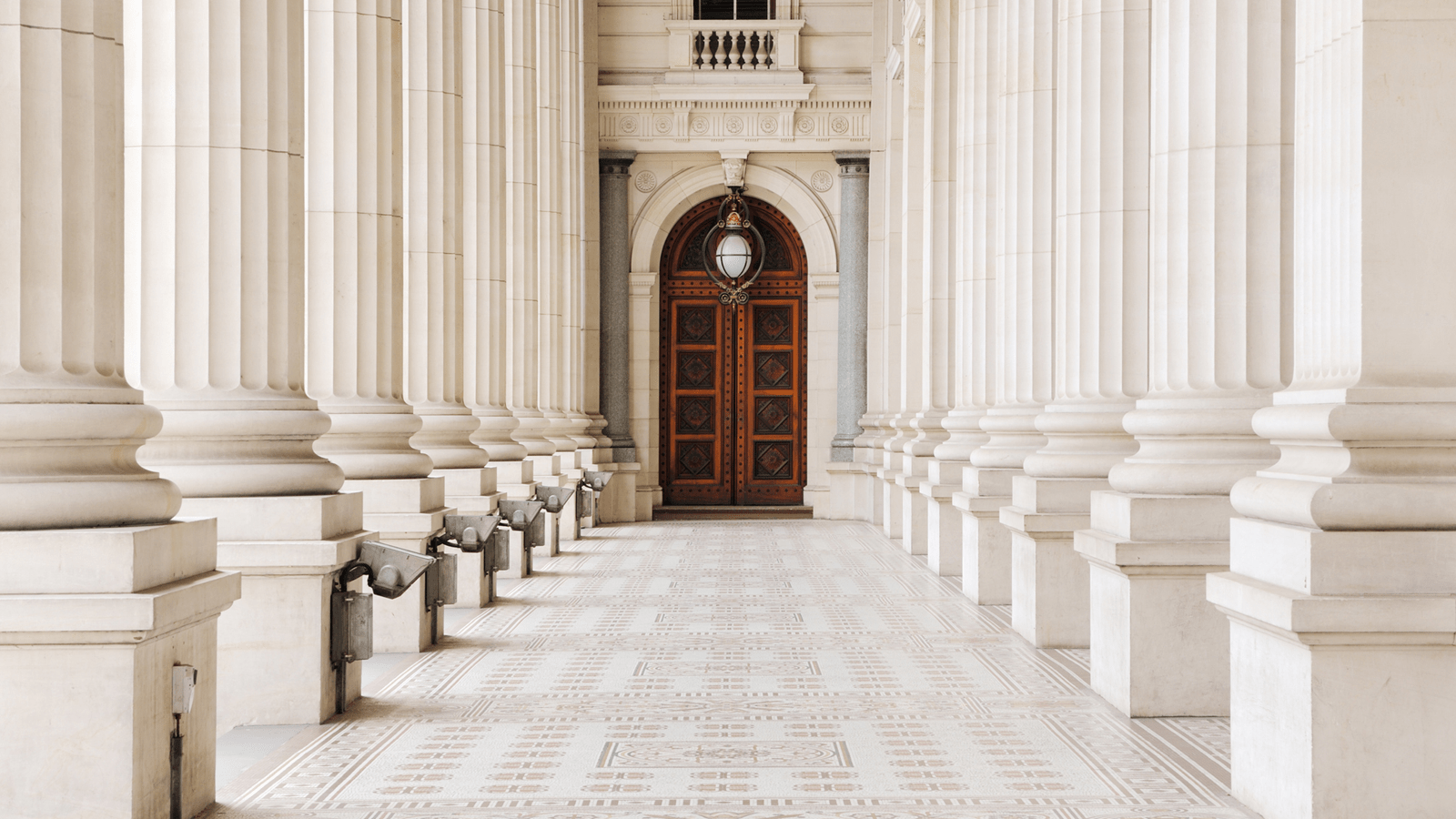 Hallway lined with column pillars