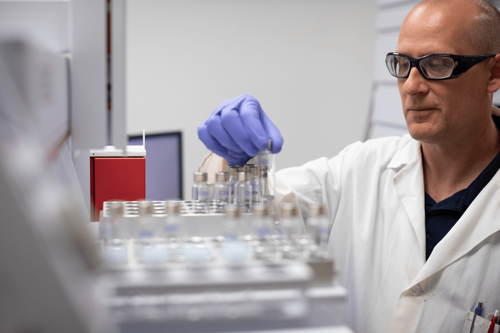 Man_Examining_Vials_Horiz-1680x1120