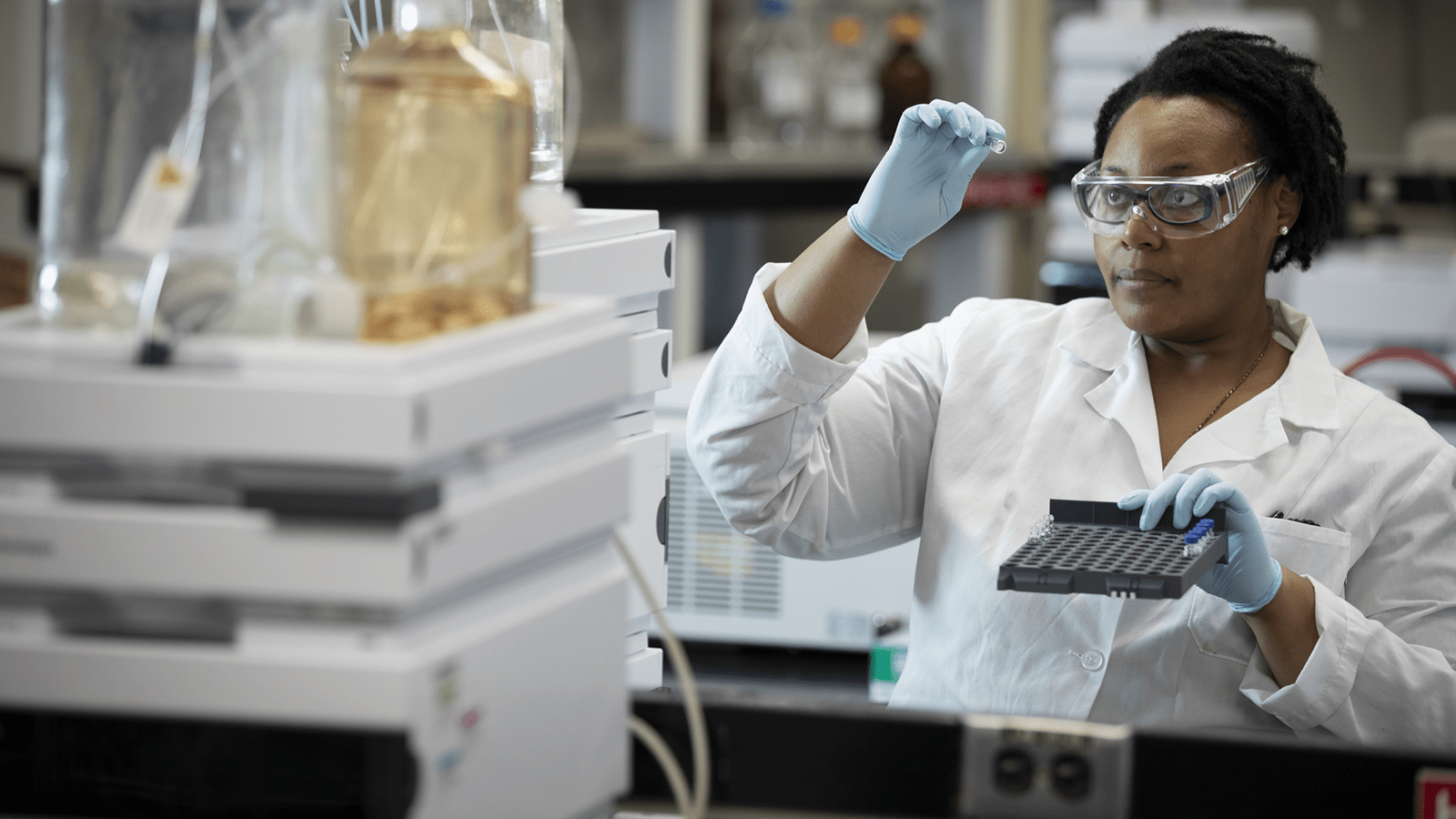 Woman Looking At Vial