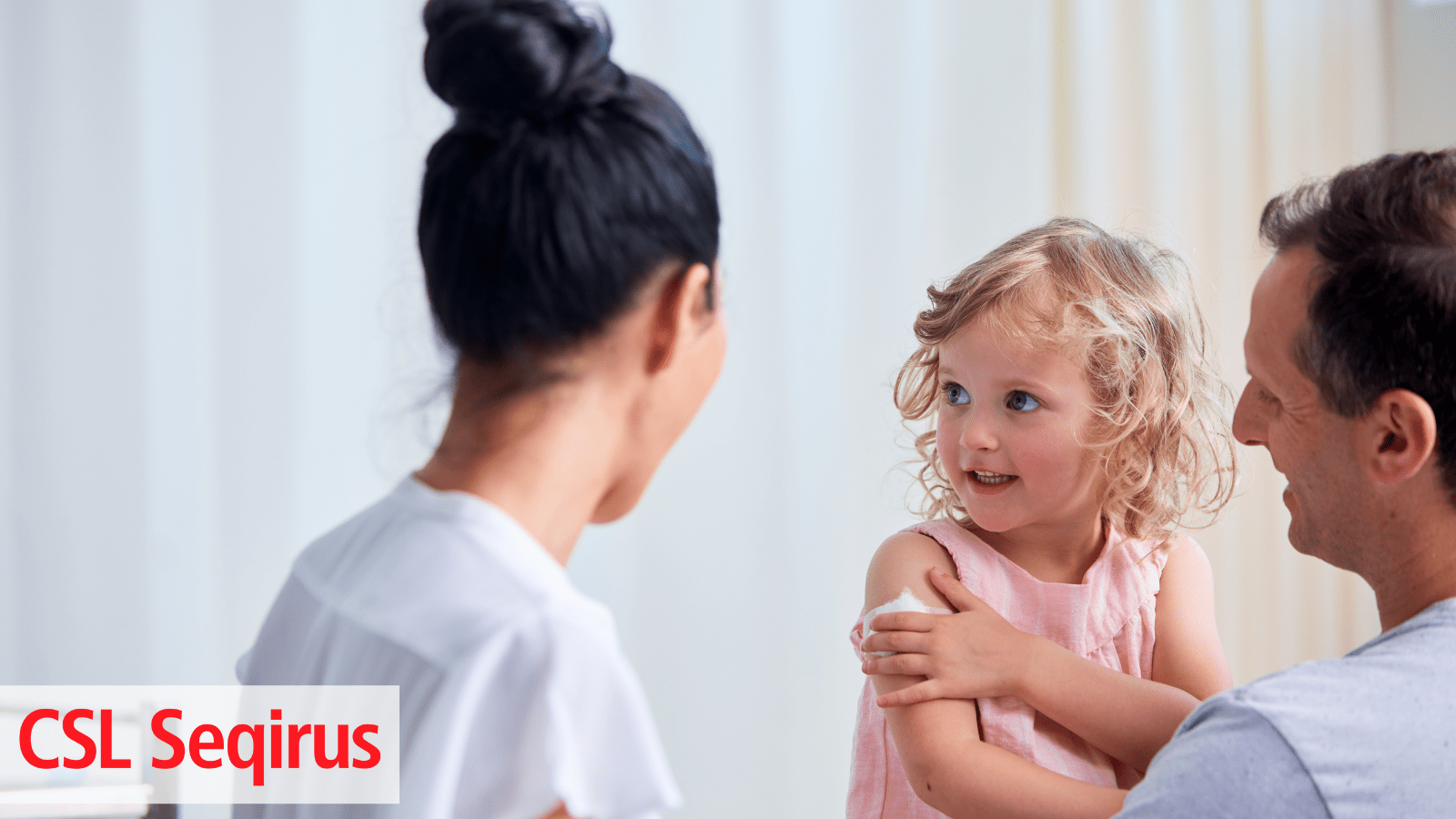 Young girl receives a seasonal influenza vaccination at the doctor's office.