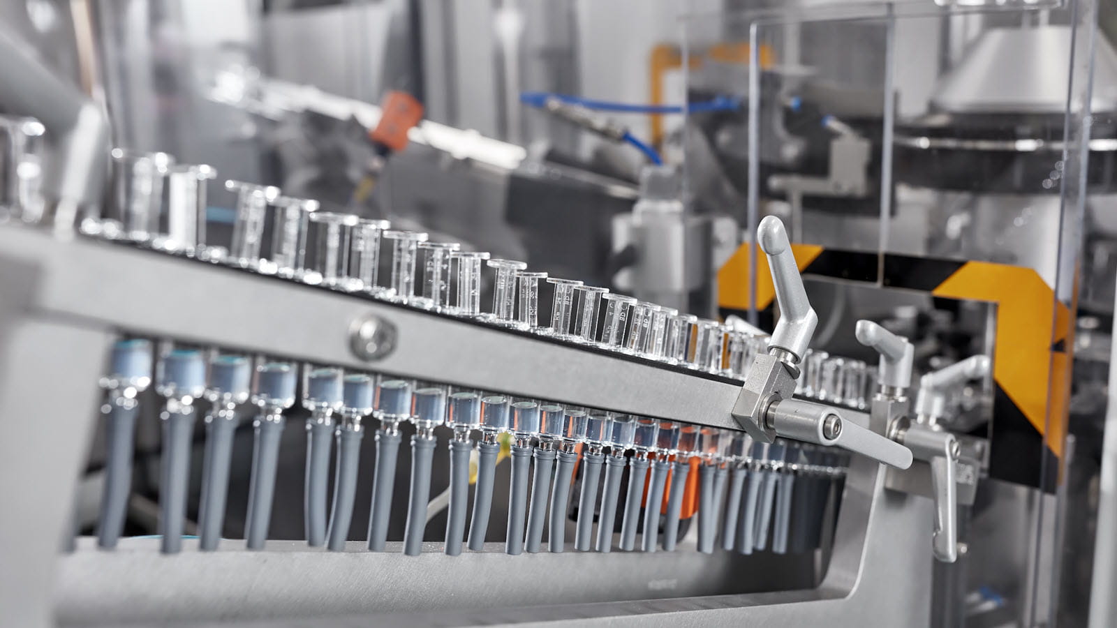Vaccine syringes being filled at a Seqirus fill & finish facility