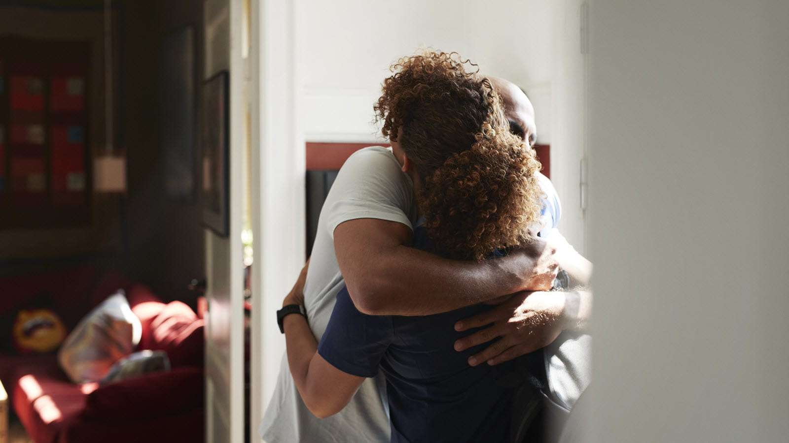 A couple hugs at home