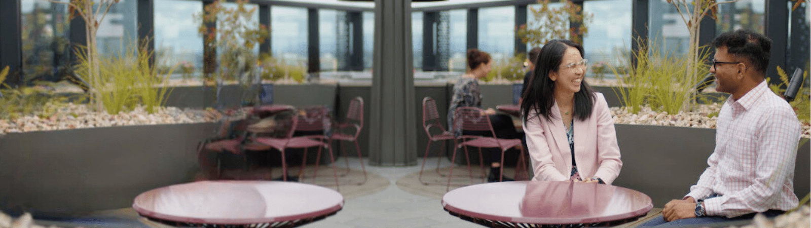 CSL employees sit on a balcony in Melbourne, Australia