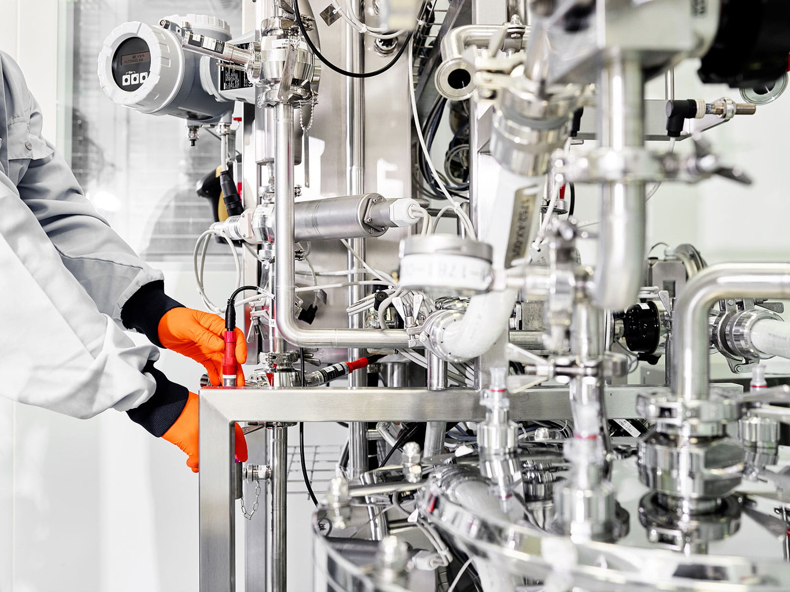 Bern manufacturing employee adjusting settings tank