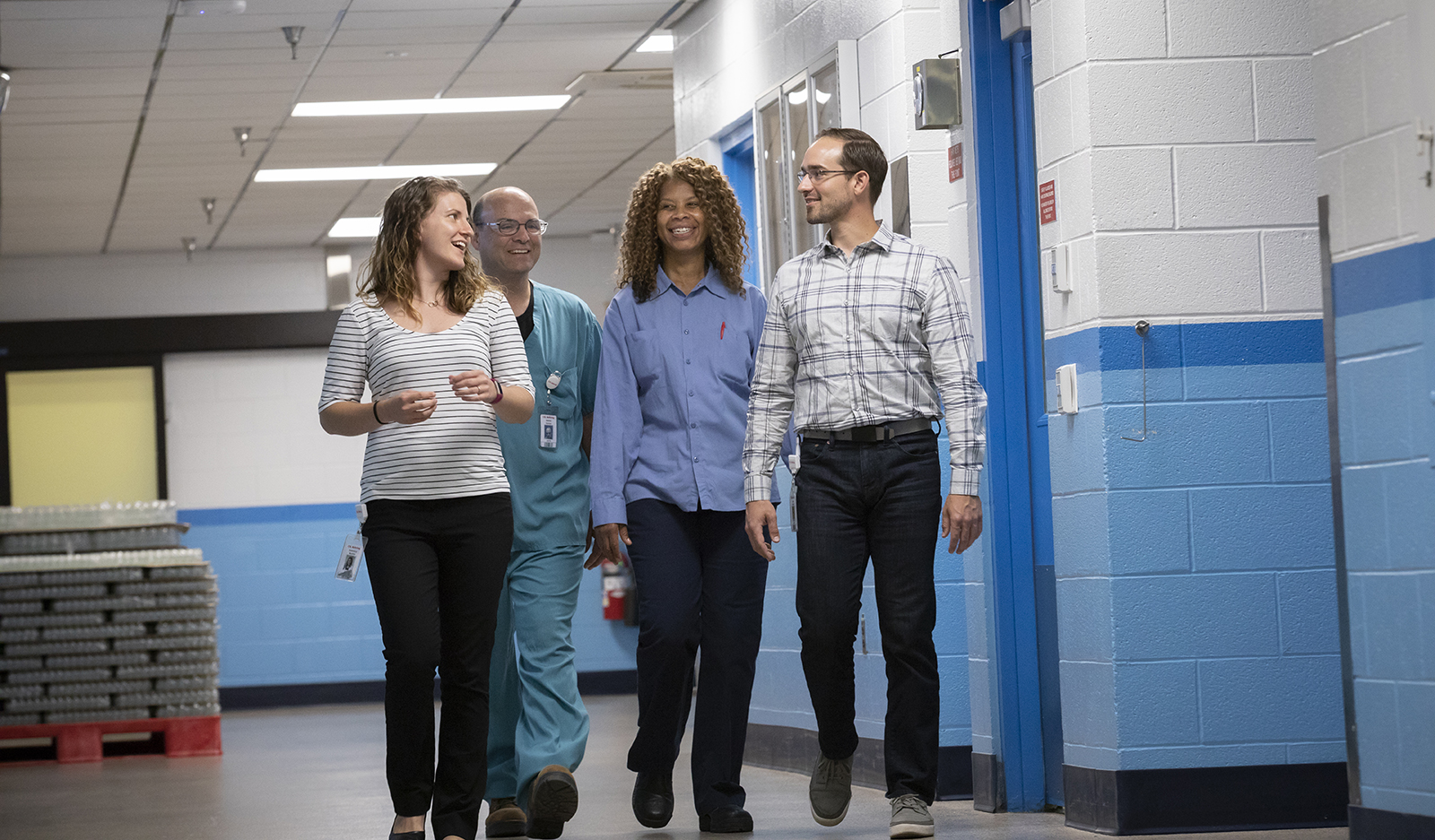 CSL Behring four researchers in a hallway