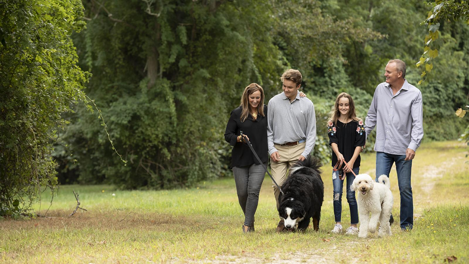 Logan and his family walking their dogs