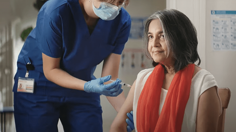 Lady receiving a vaccine injection