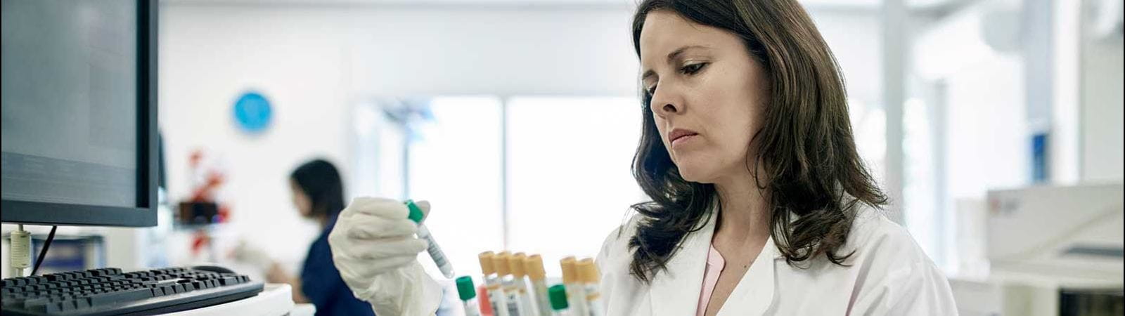 Female scientist with test tubes