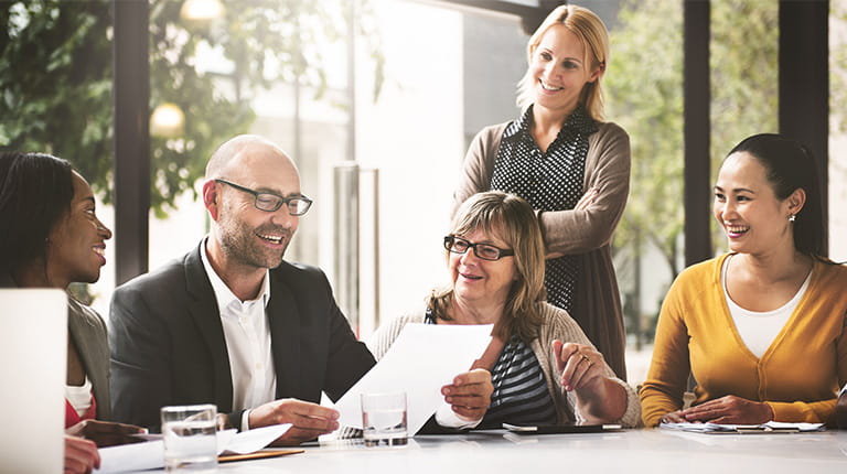 Group looking at their dividend information