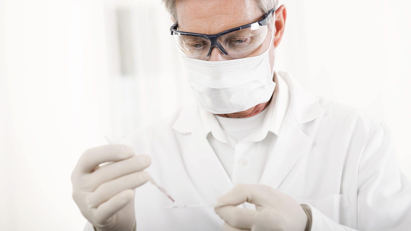 Researcher testing sample