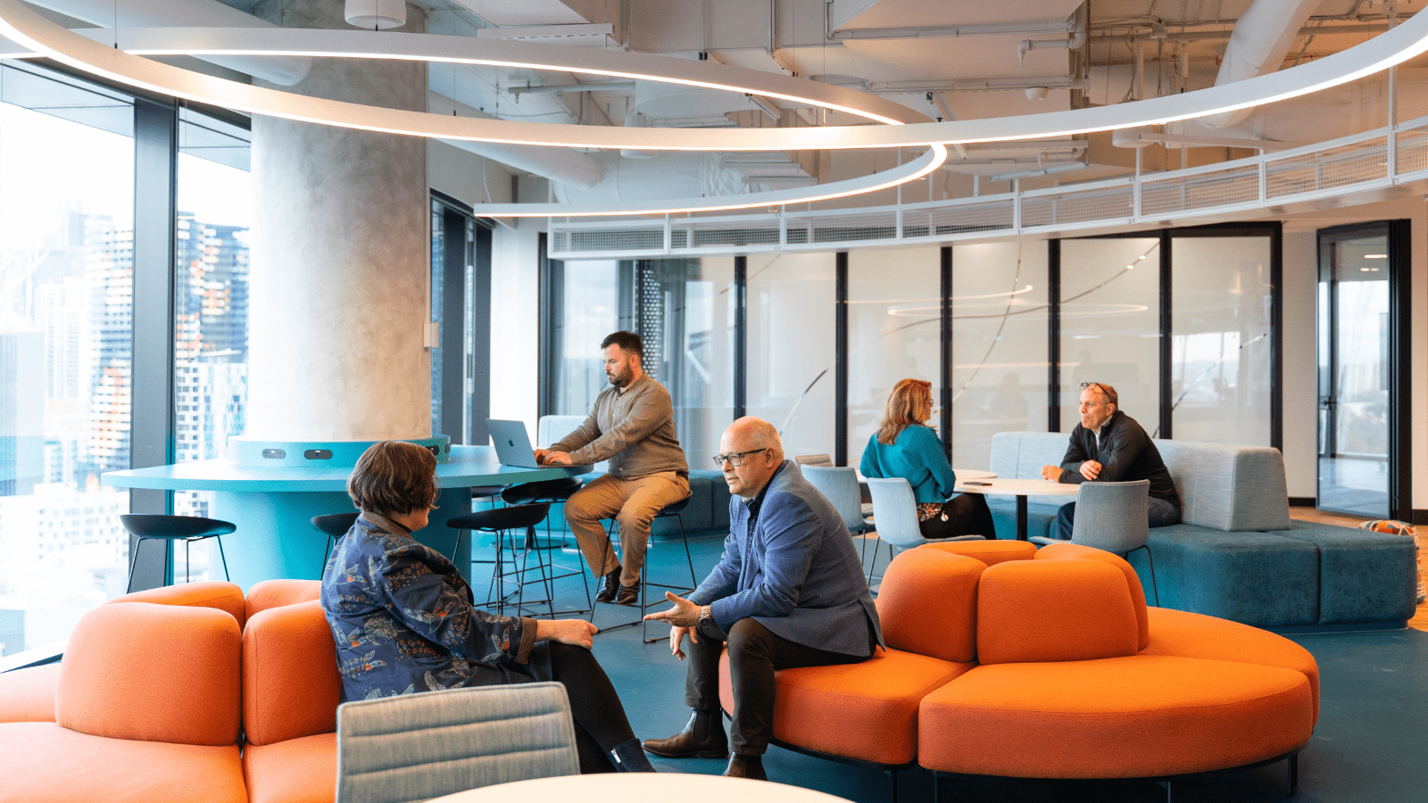 Image of people sitting in a relaxed meeting space