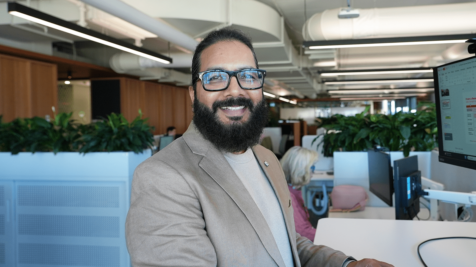 Photograph of Sunil Kumar Raja in an office environment