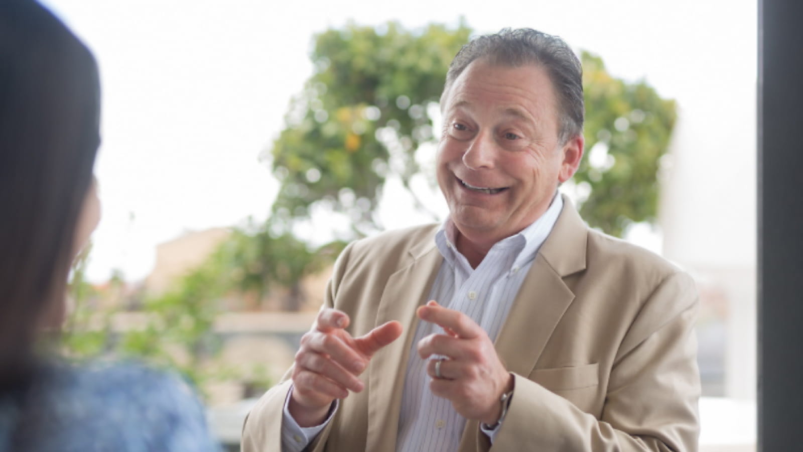 Dr. Gregg Sylvester in a conversation outdoors