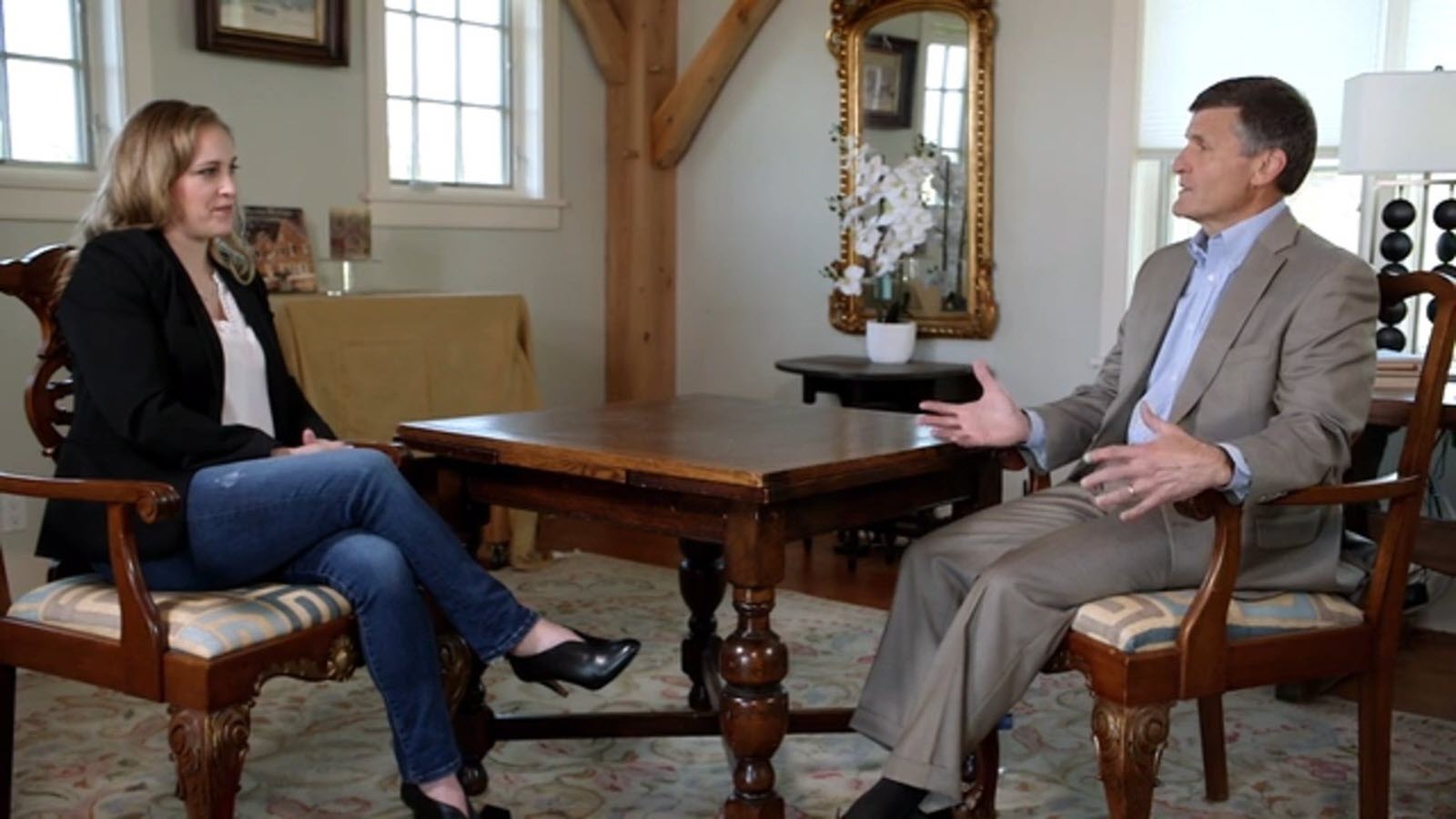 Jennifer Arters and Bill Mezzanotte seated at a table to discuss her clinical trial experience