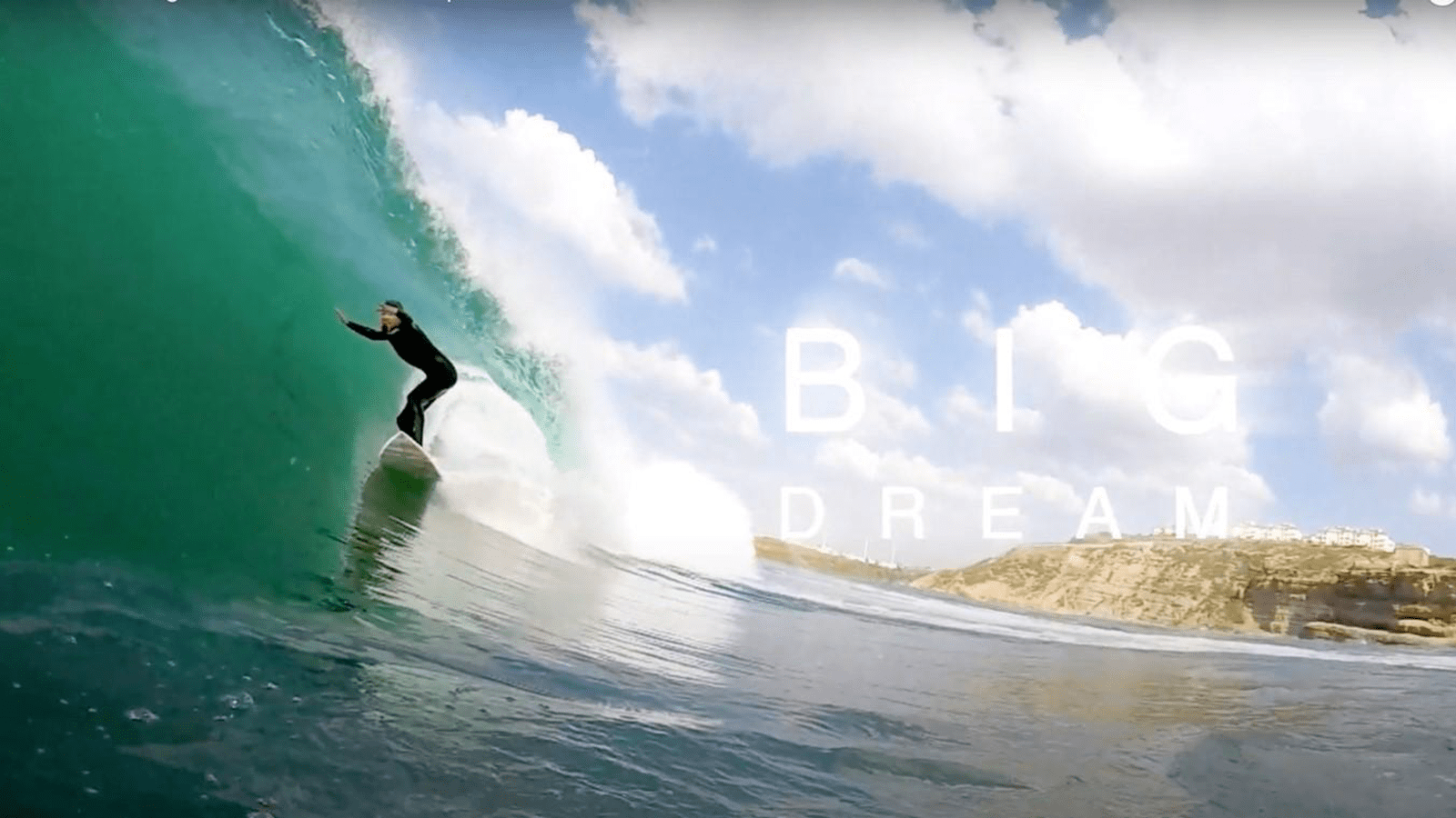 Surfer Arran Strong in the curl of a wave