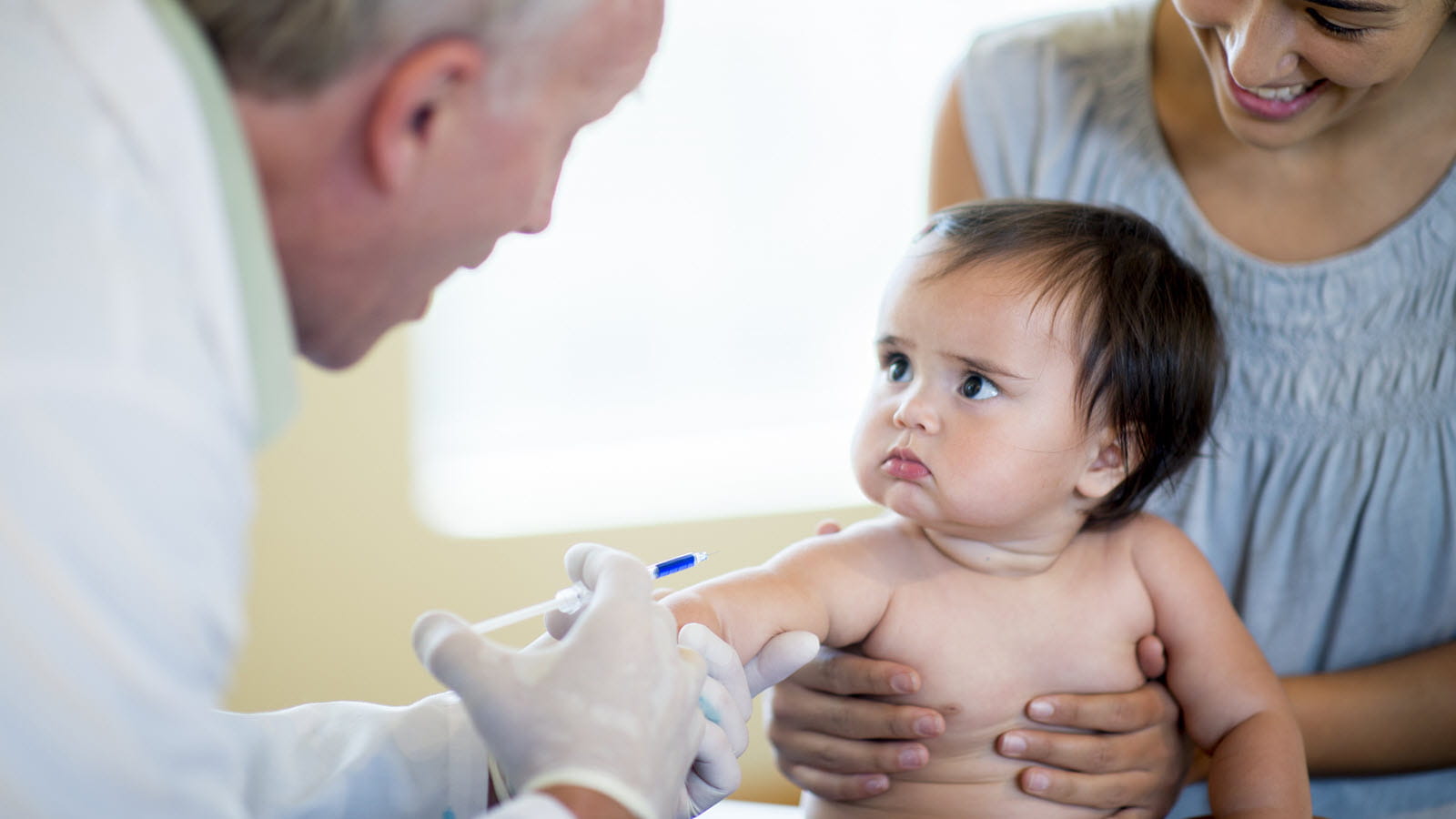 Baby looking worried before a vaccination