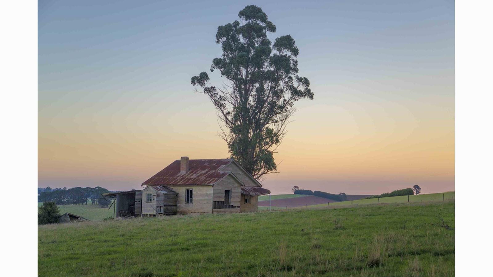 Home set against the transitioning sky in Gippsland, Victoria, Australia