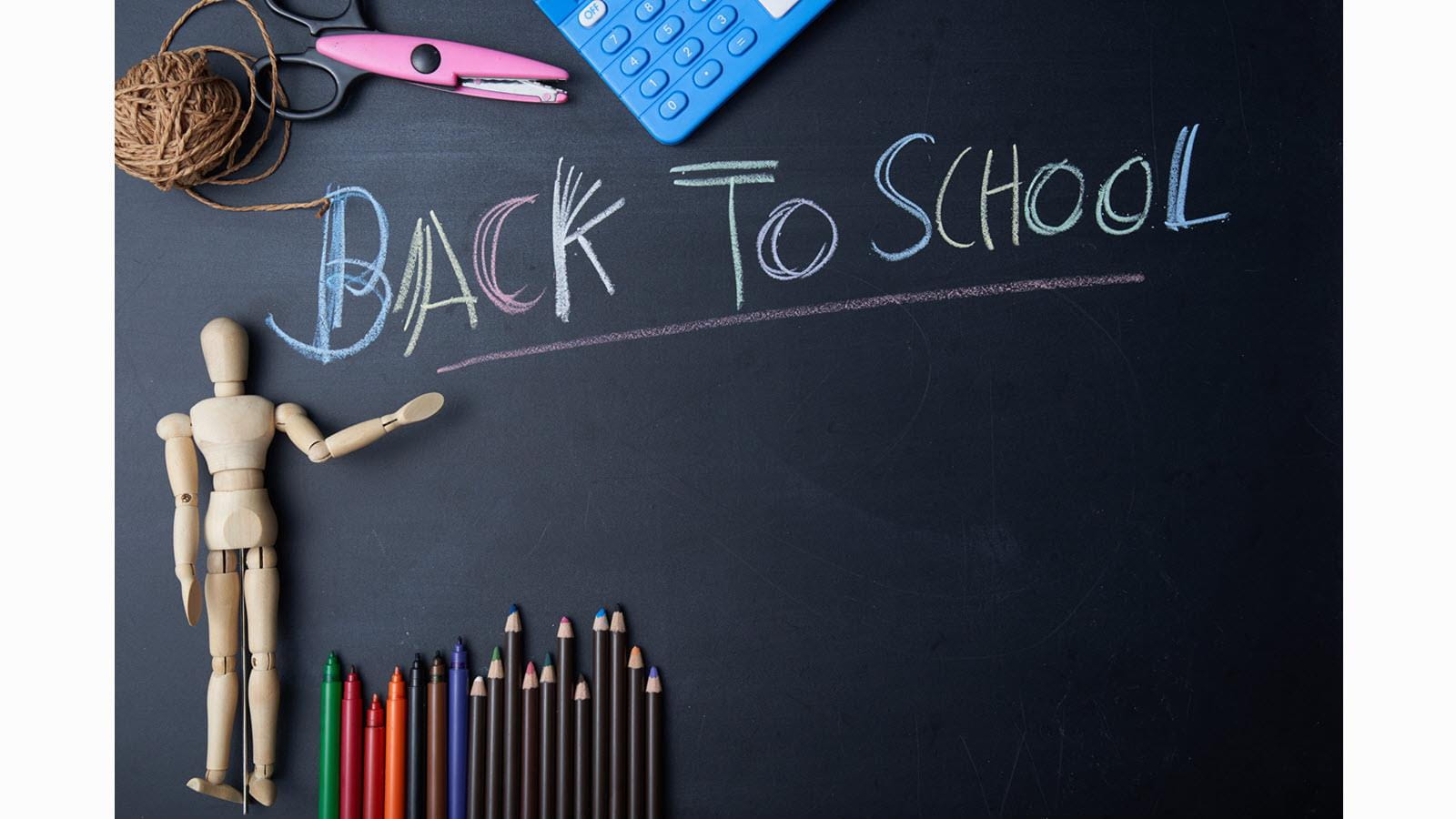 Chalkboard that says "back to school" in multicolor chalk