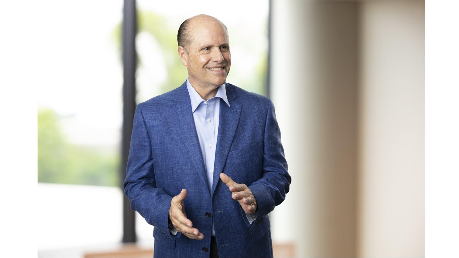 CSL Limited CEO Paul Perreault in front of a window in a blue jacket