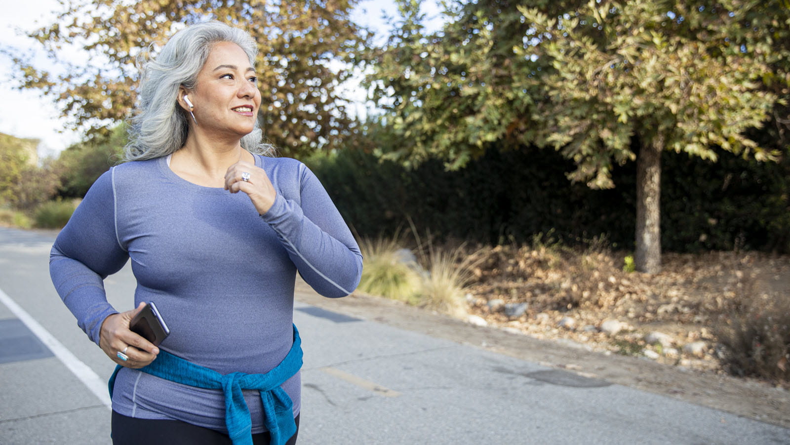 gray-haired woman jogging 