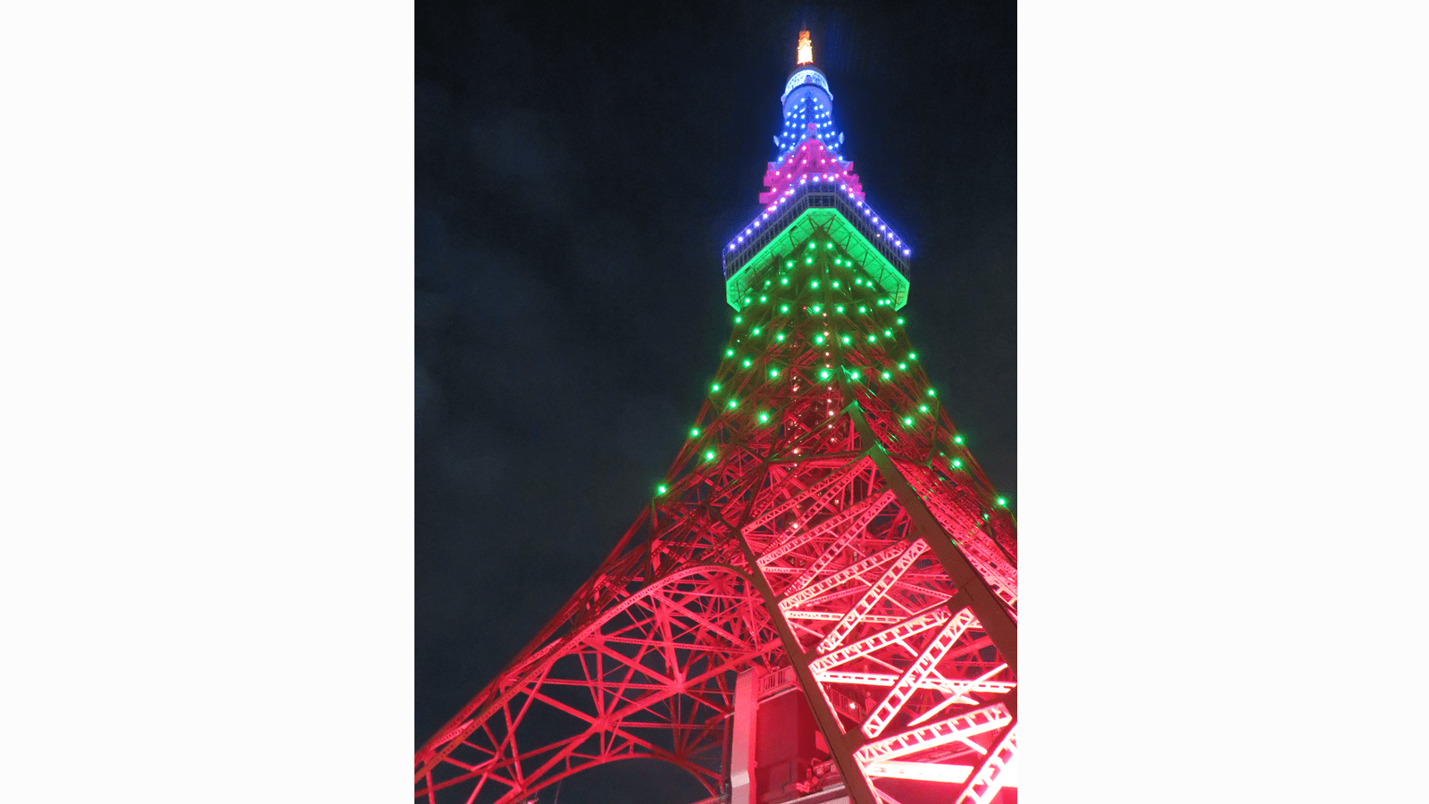 The Tokyo Tower in Japan lit up in the pink, green, purple and blue colors of Rare Disease Day.