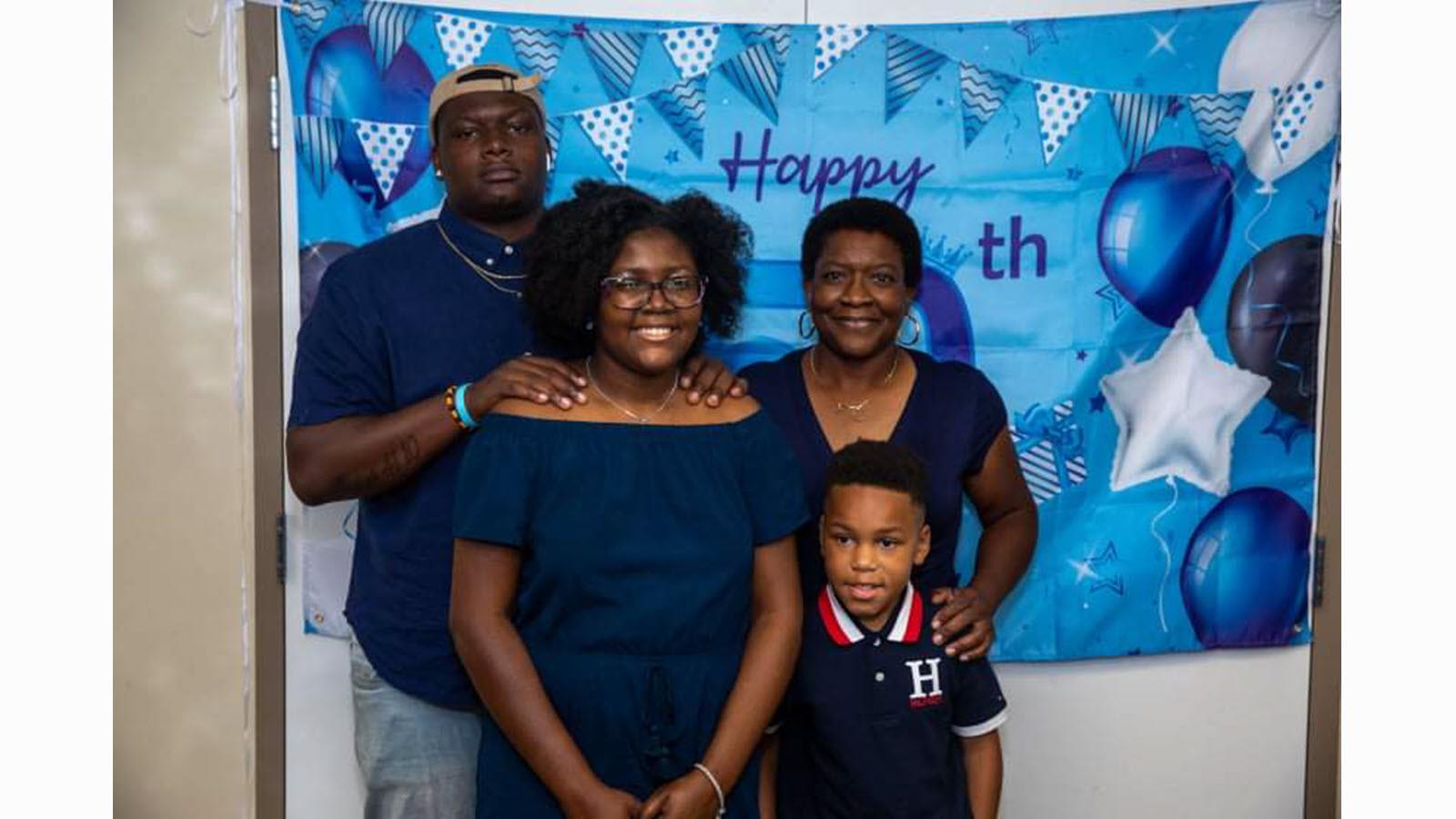 Judith McClellan and family in a snapshot at a birthday party