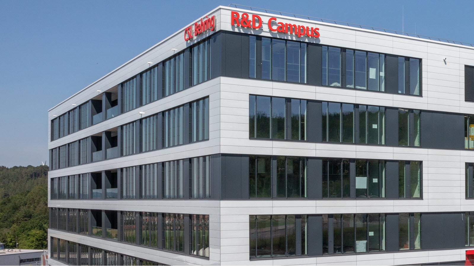 Exterior of CSL's new R&D building in Marburg, Germany. Red letters say CSL Behring R&D Campus