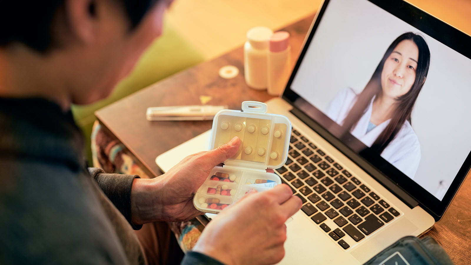 Patient sees his doctor via a virtual visit on his laptop