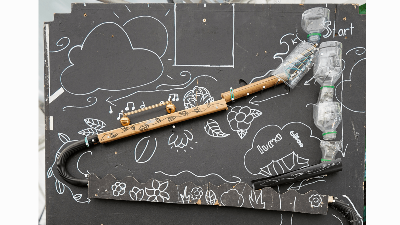 An elaborate homemade marble raceway using water bottles
