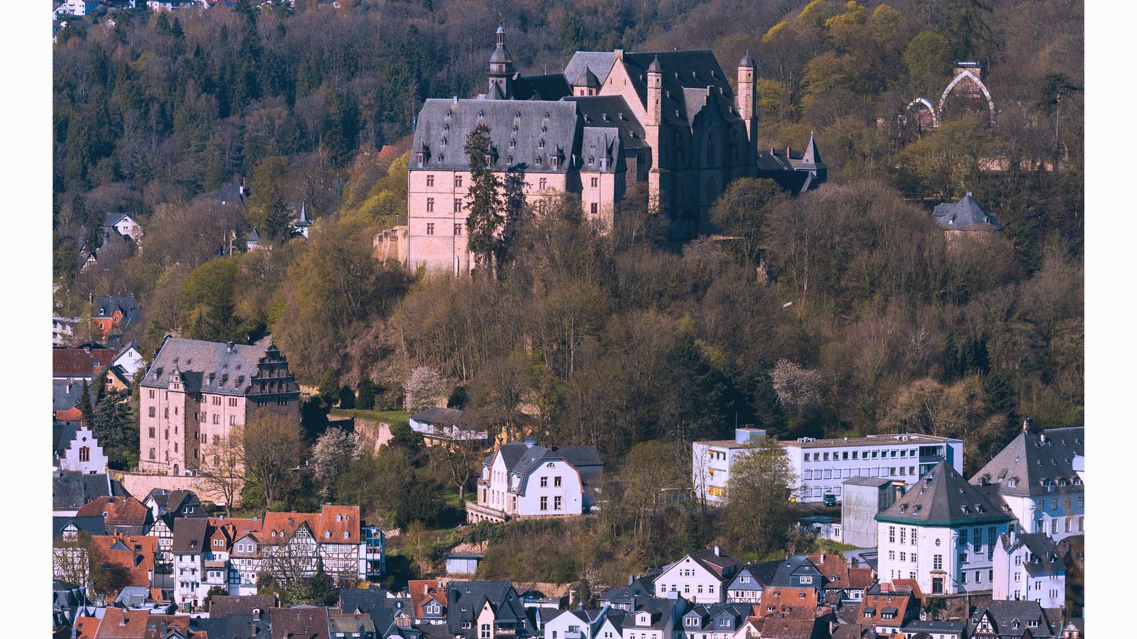 The landscape of Marburg, Germany, featuring a castle on the hillside
