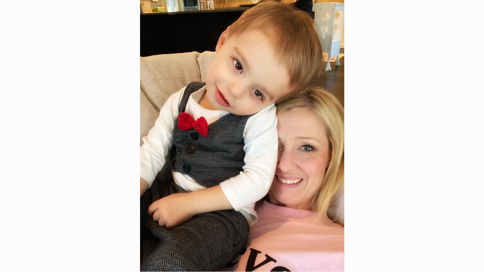 Max Freed (wearing a toddler tuxedo shirt) with his mother, Amber Freed