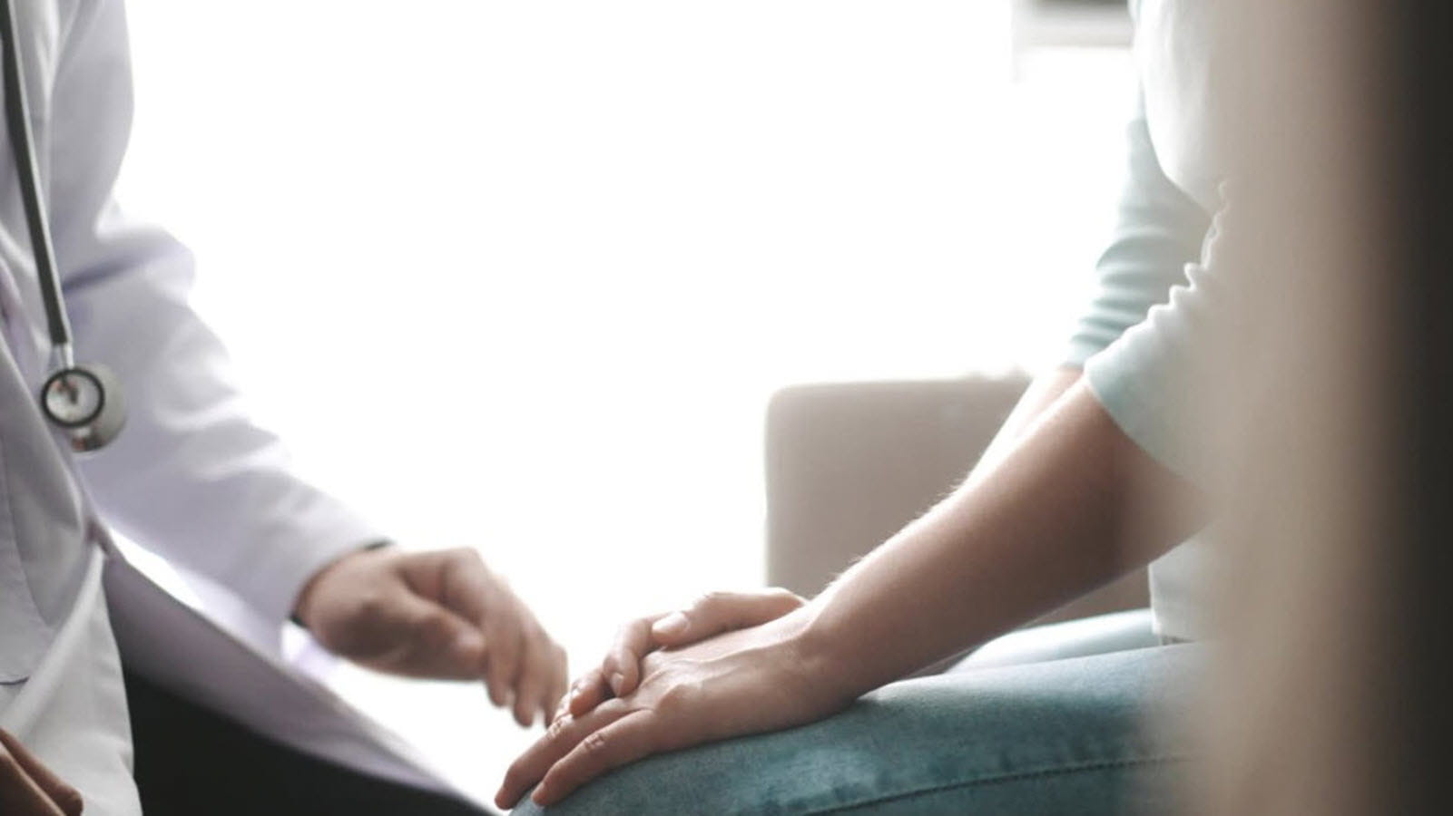 a doctor-patient conversation showing only their hands
