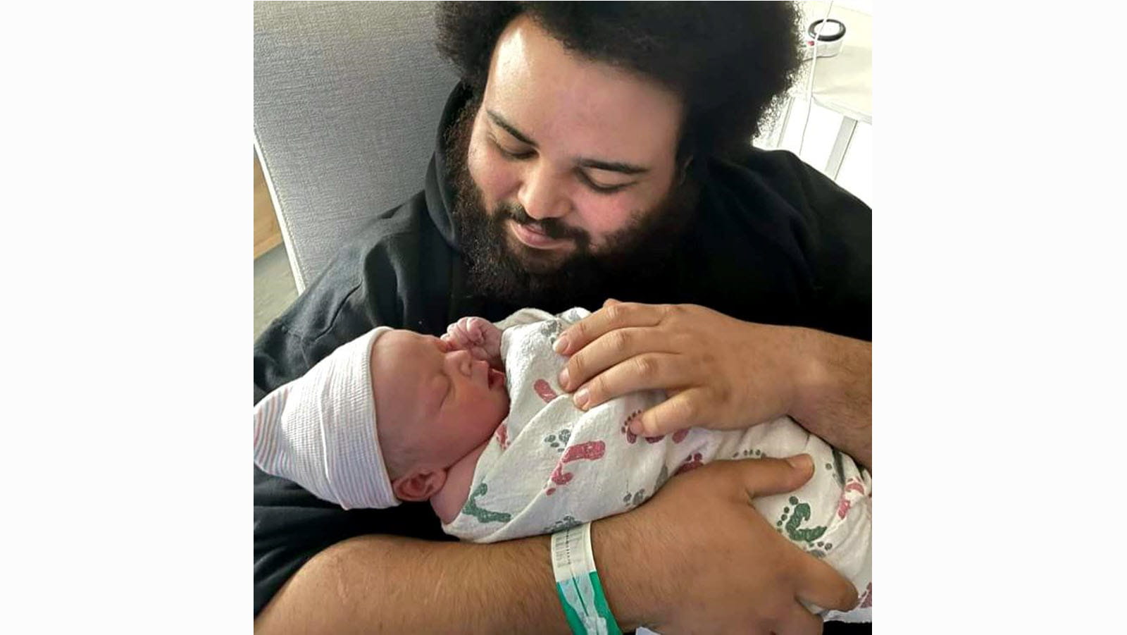 CSL Plasma employee Corey Brown and infant son