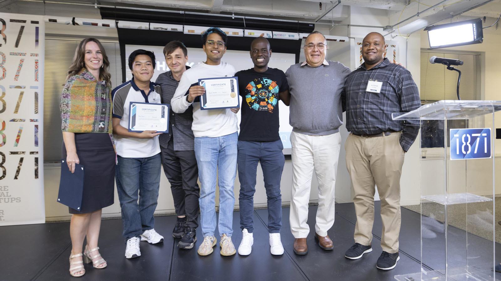 Ian Njoroge, far right, with winning team in quantum computing competition.