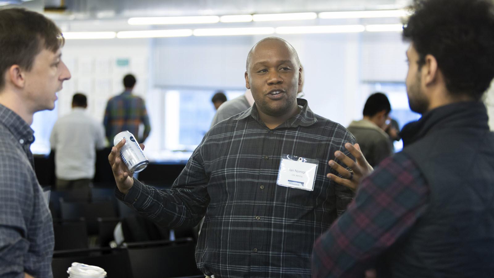 Ian Njoroge in conversation at a quantum computing event in Chicago