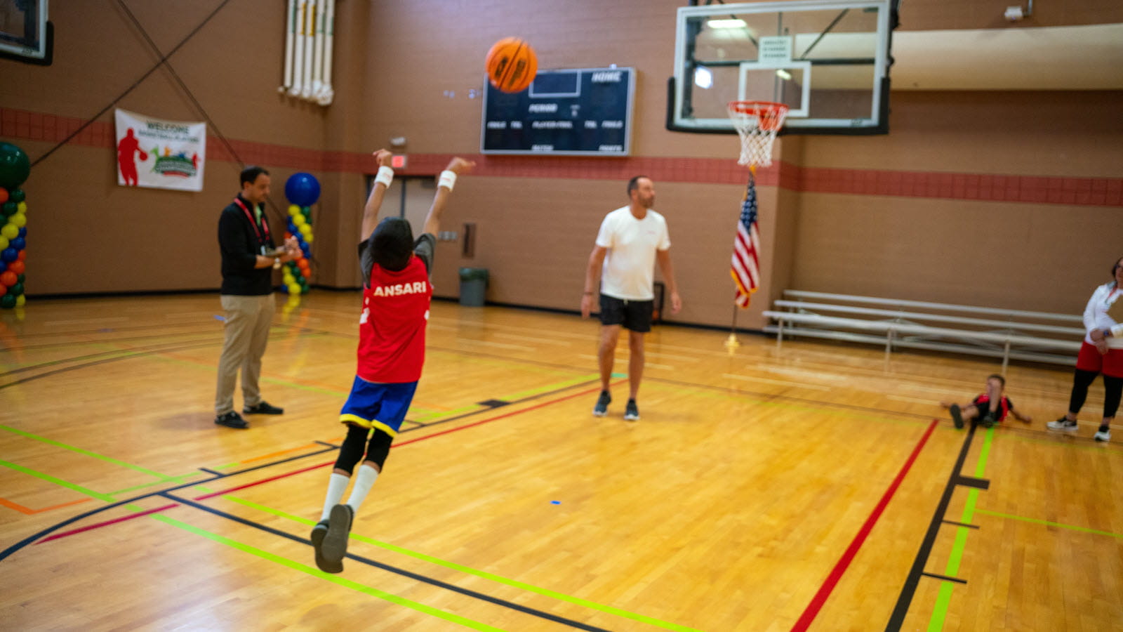 Young basketball player jumps and shoots