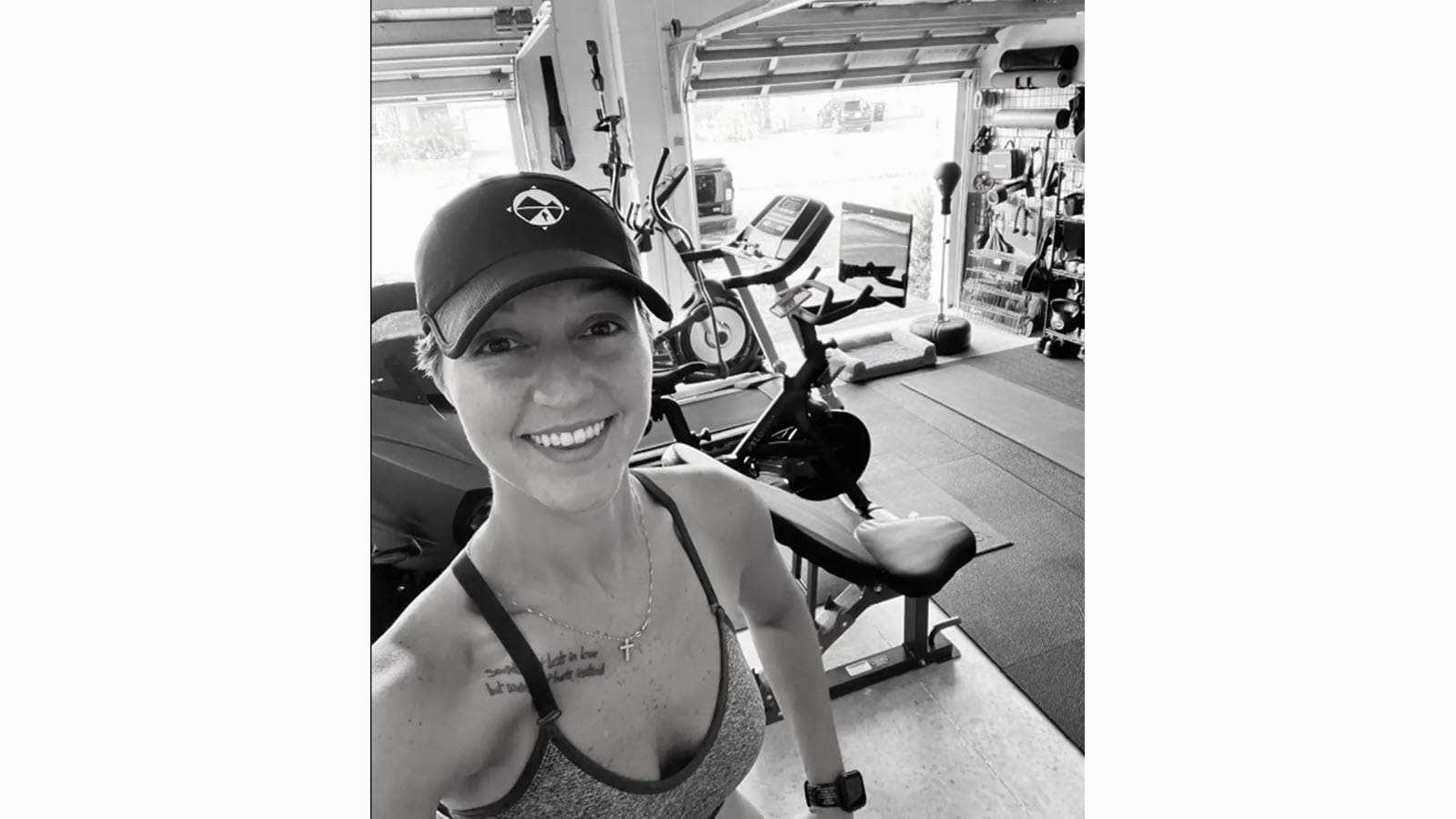 Chelsea Young working out in a garage gym