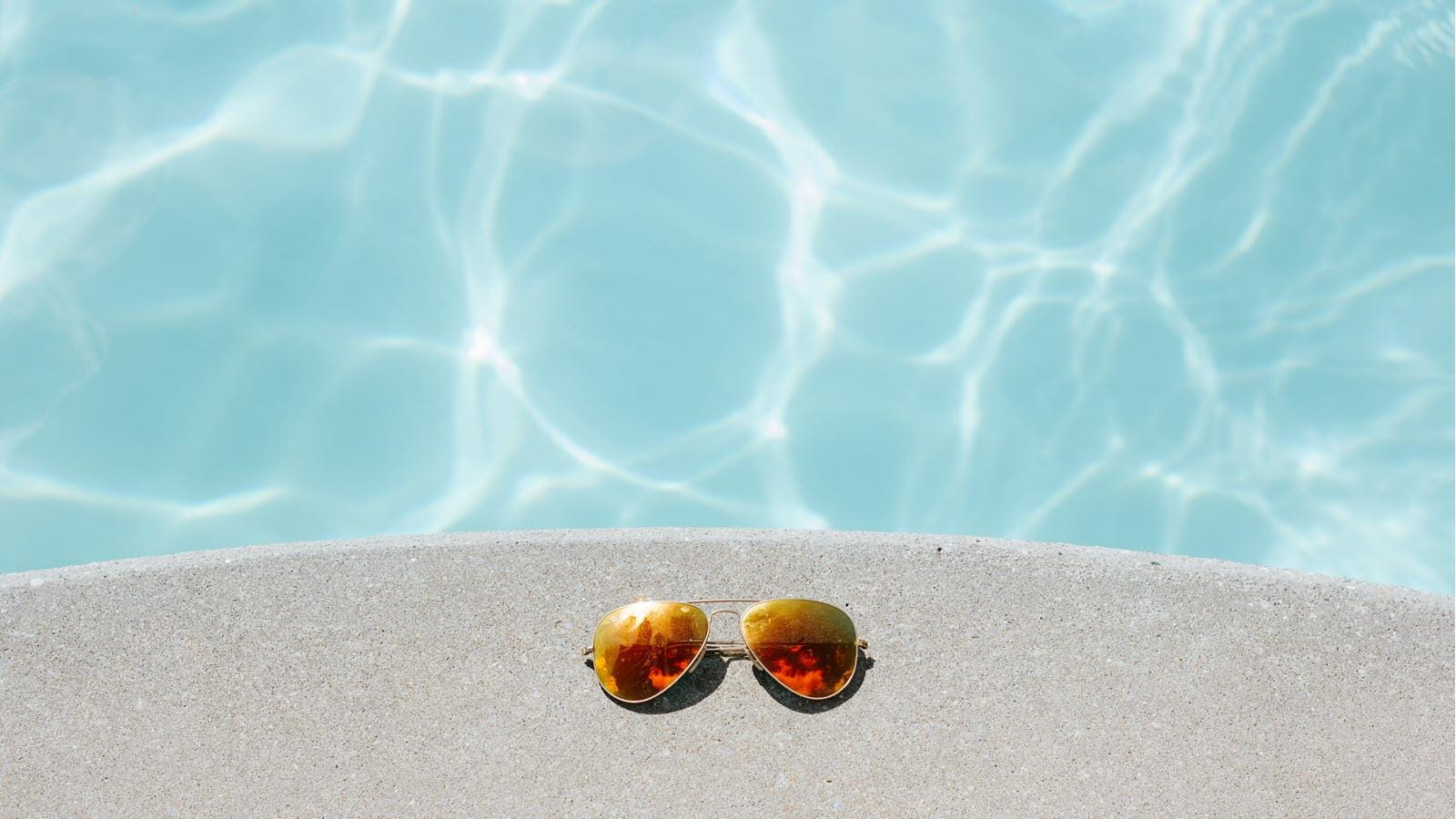 Mirrored sunglasses at poolside