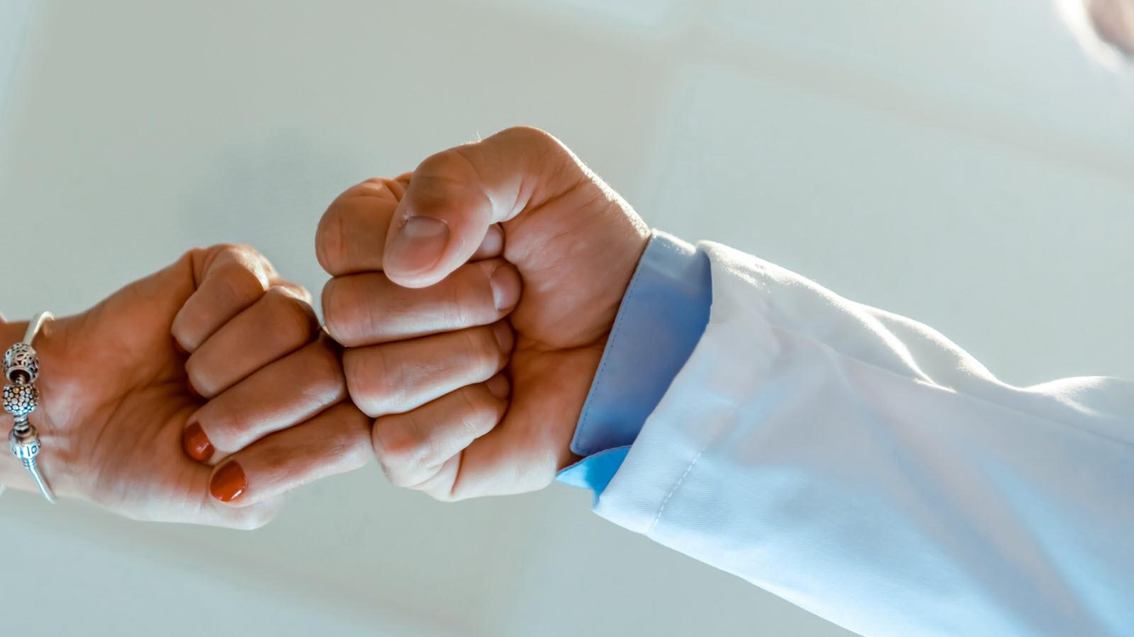 Doctor and patient fist bump