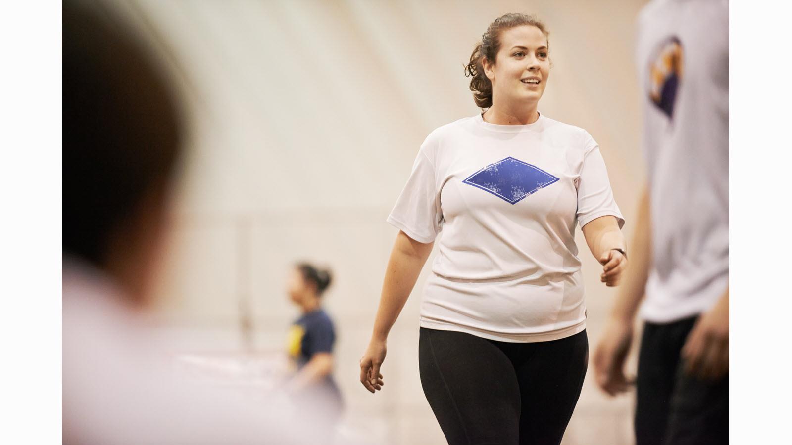 Curvy woman takes part in an exercise class